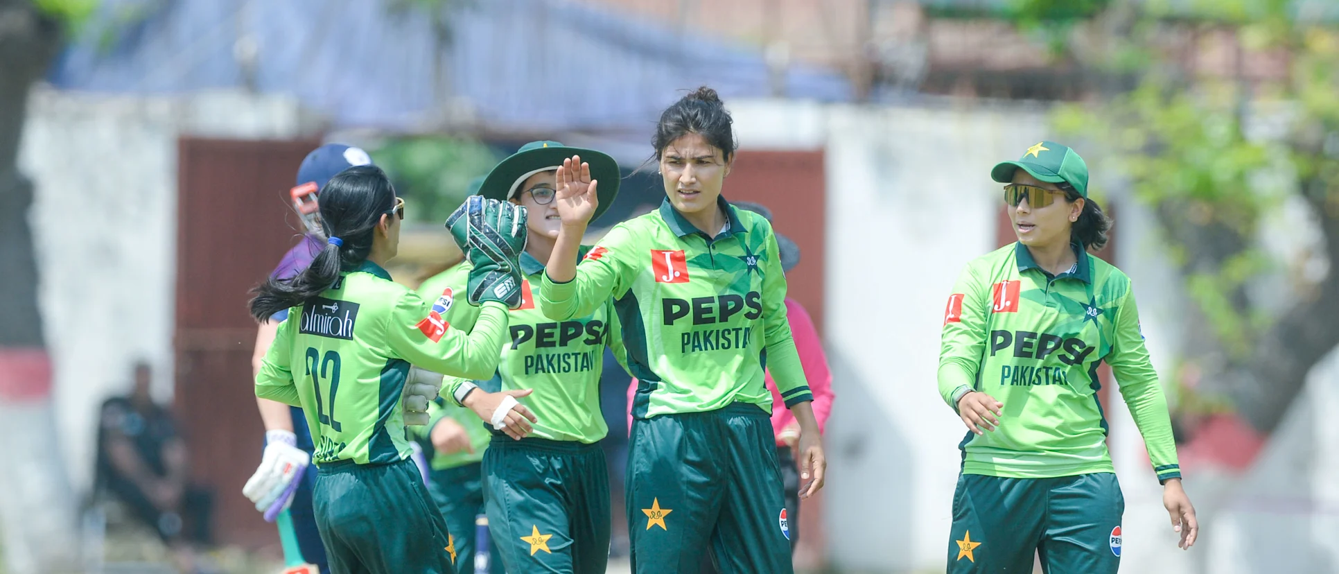 Logo of Pakistan players celebrate