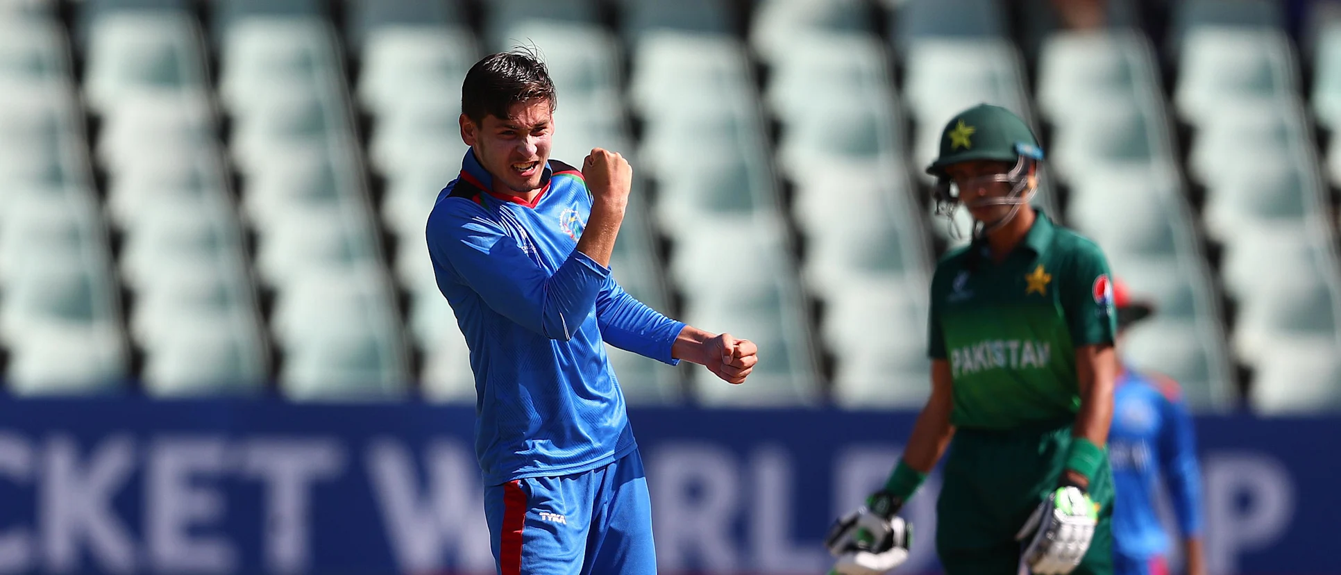 Logo of Noor Ahmad celebrates after picking up a wicket against Pakistan in the 2020 U19 ICC Men's Cricket World Cup