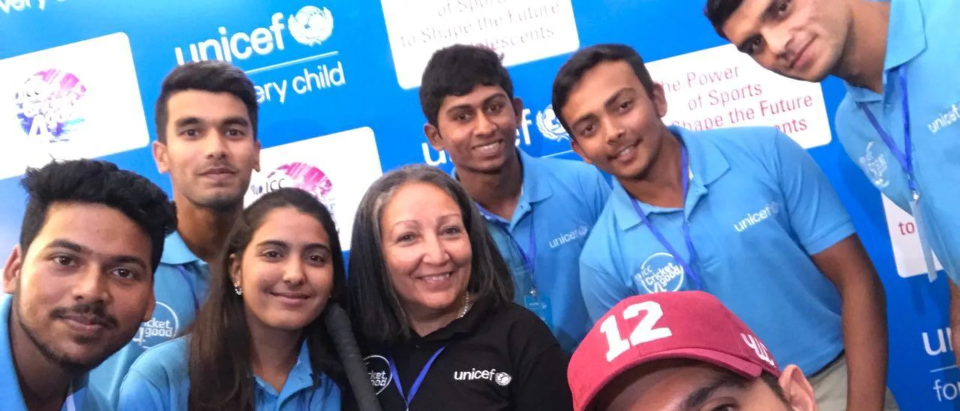 Logo of Yuvraj Singh with the U19 players at the UNICEF event.
