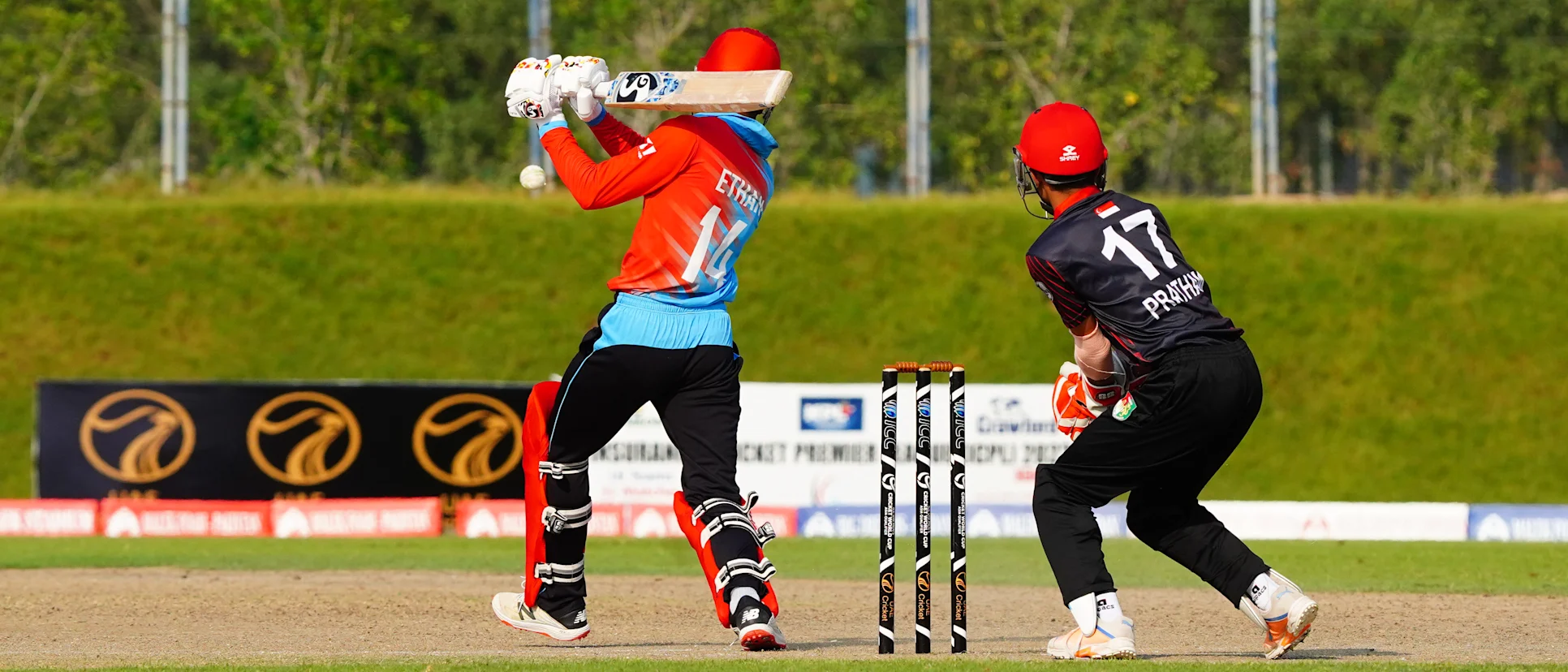 Logo of Singapore and Kuwait players in action in the ICC U19 Men's CWC Asia Division 1 Qualifier 2023