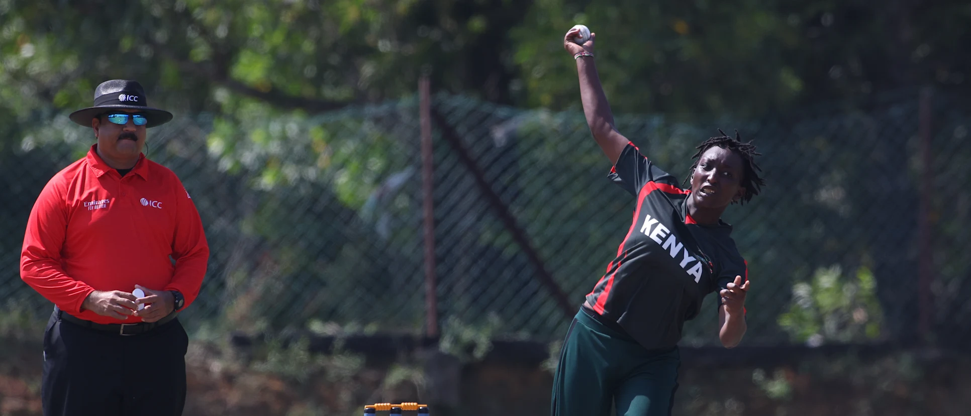 Logo of Esther Wangare Wachira of Kenya bowling during the CWG Qualifier 2022