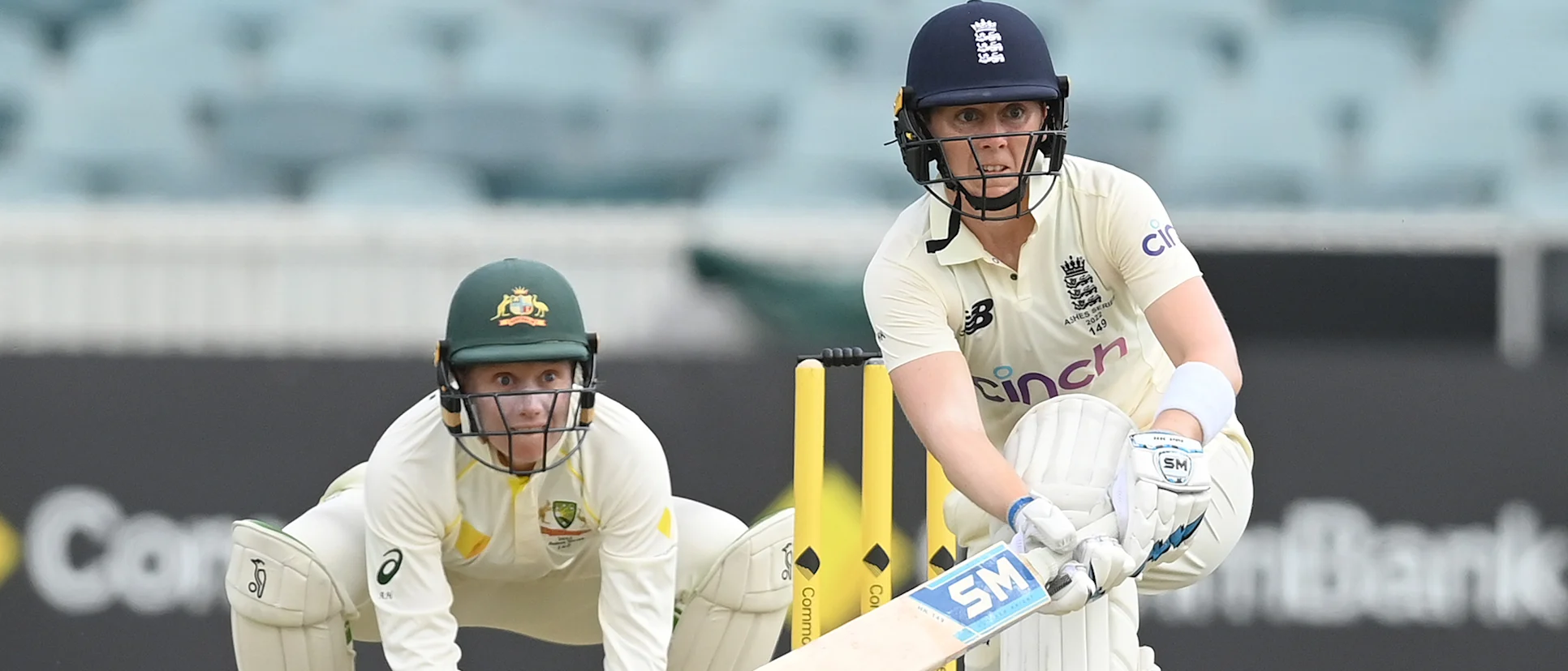 Heather Knight of England bats watched by Alyssa Healy of Australia during day two of the Women's Test match in the Ashes series between Australia and England at Manuka Oval