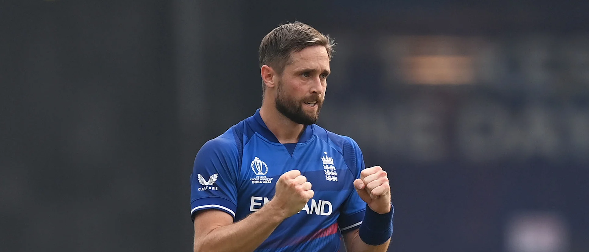 Logo of Chris Woakes of England celebrates the wicket of Shreyas Iyer of India during the ICC Men's Cricket World Cup India 2023 between India and England
