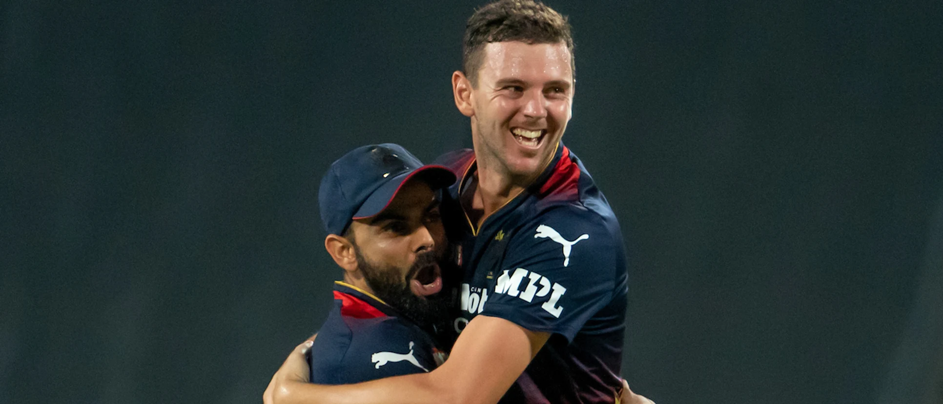 Logo of Hazlewood Kohli RCB embrace 1920x1080