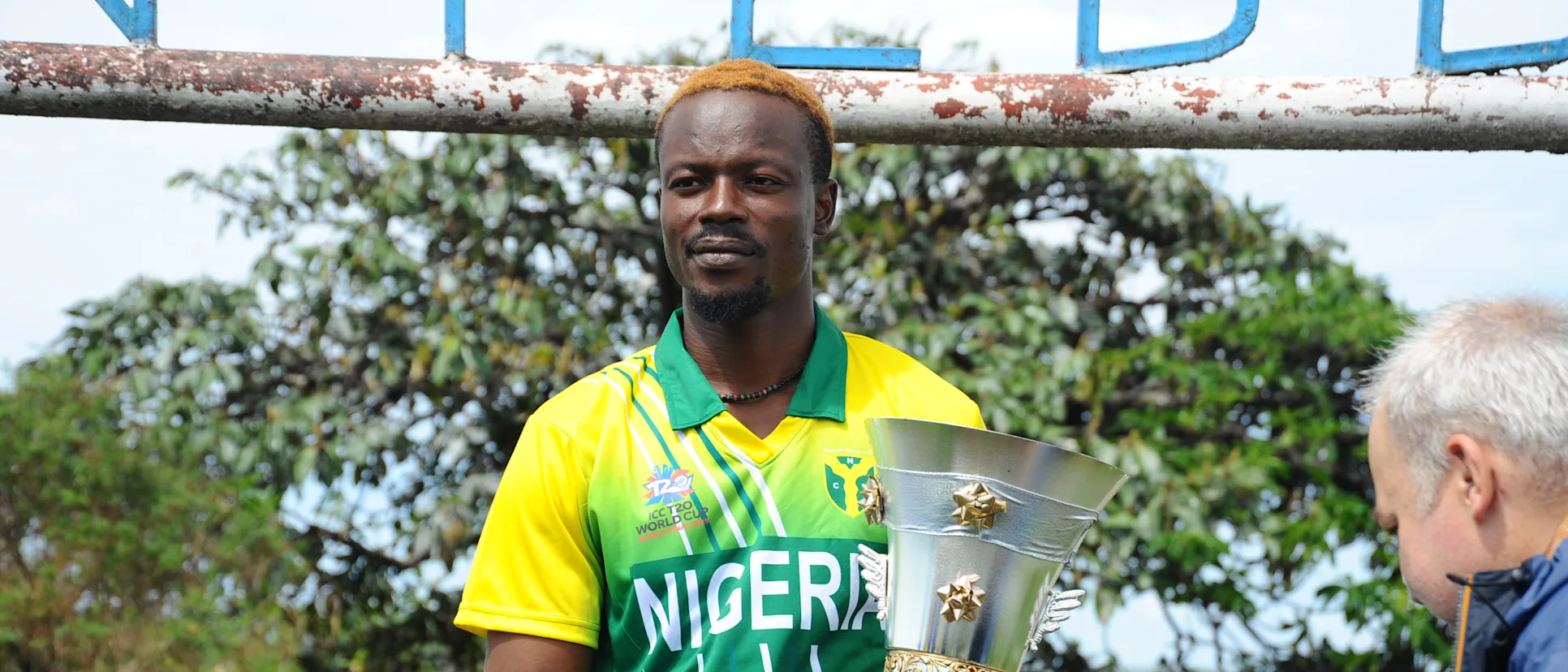 Logo of Nigeria captain Ademola Onikoyi with the ICC T20 World Cup Africa Final Qualifier trophy