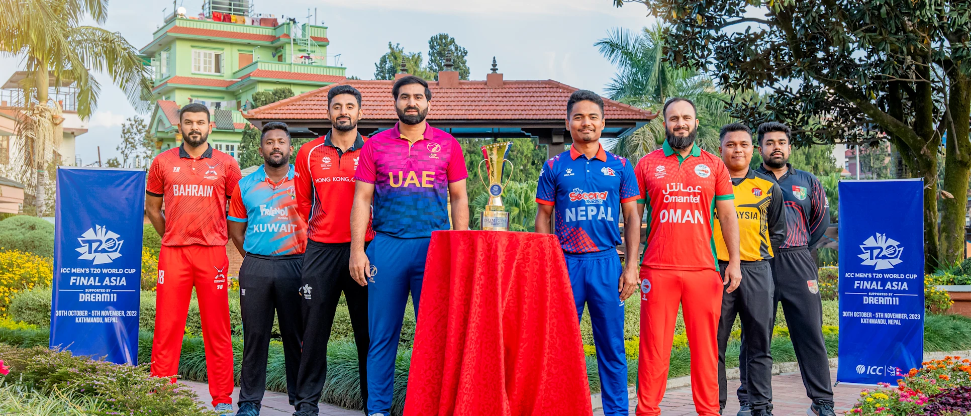 Logo of The eight captains with the trophy ahead of the ICC Men’s T20 World Cup Asia Qualifier Final in Nepal.