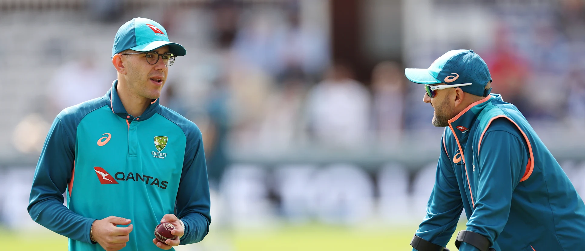 Logo of Nathan Lyon (R) chatting with Todd Murphy (L) before the start of the third day's play at Lord's