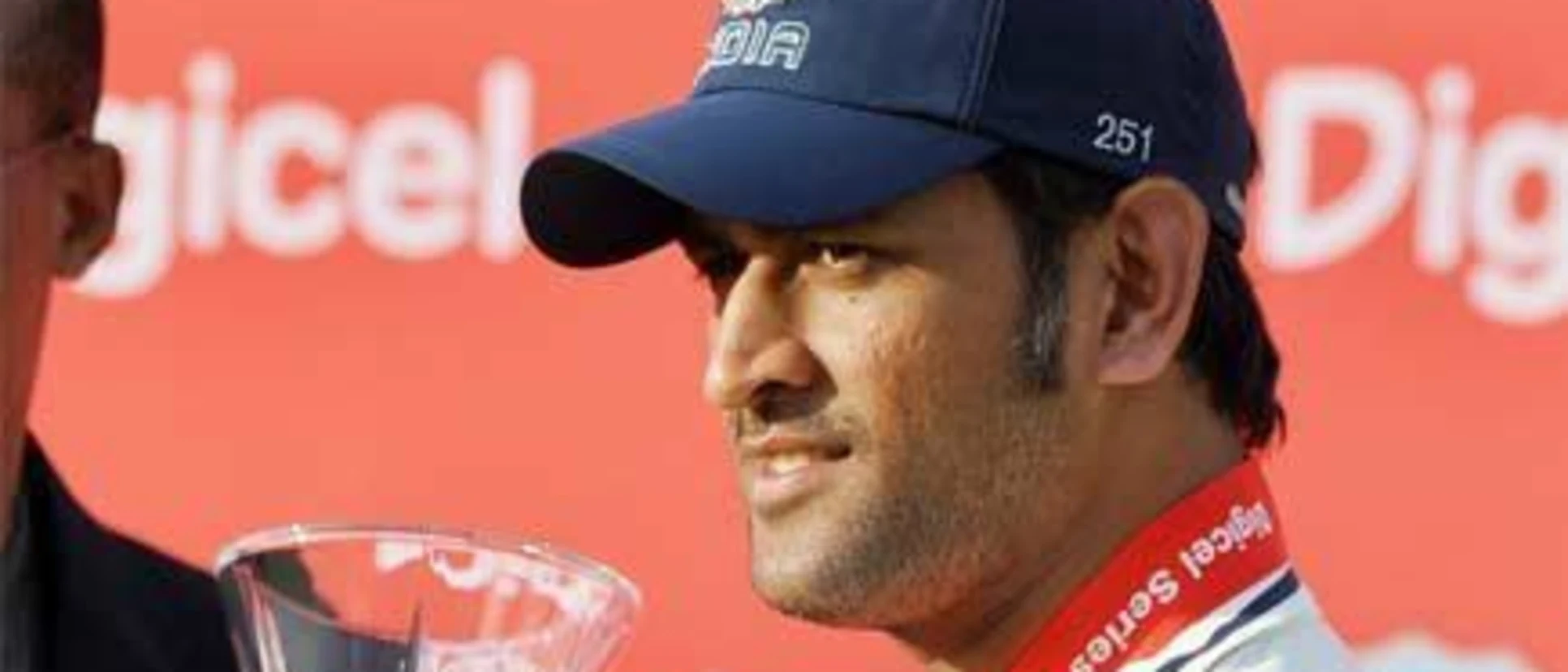 23911 MS Dhoni with the series trophy