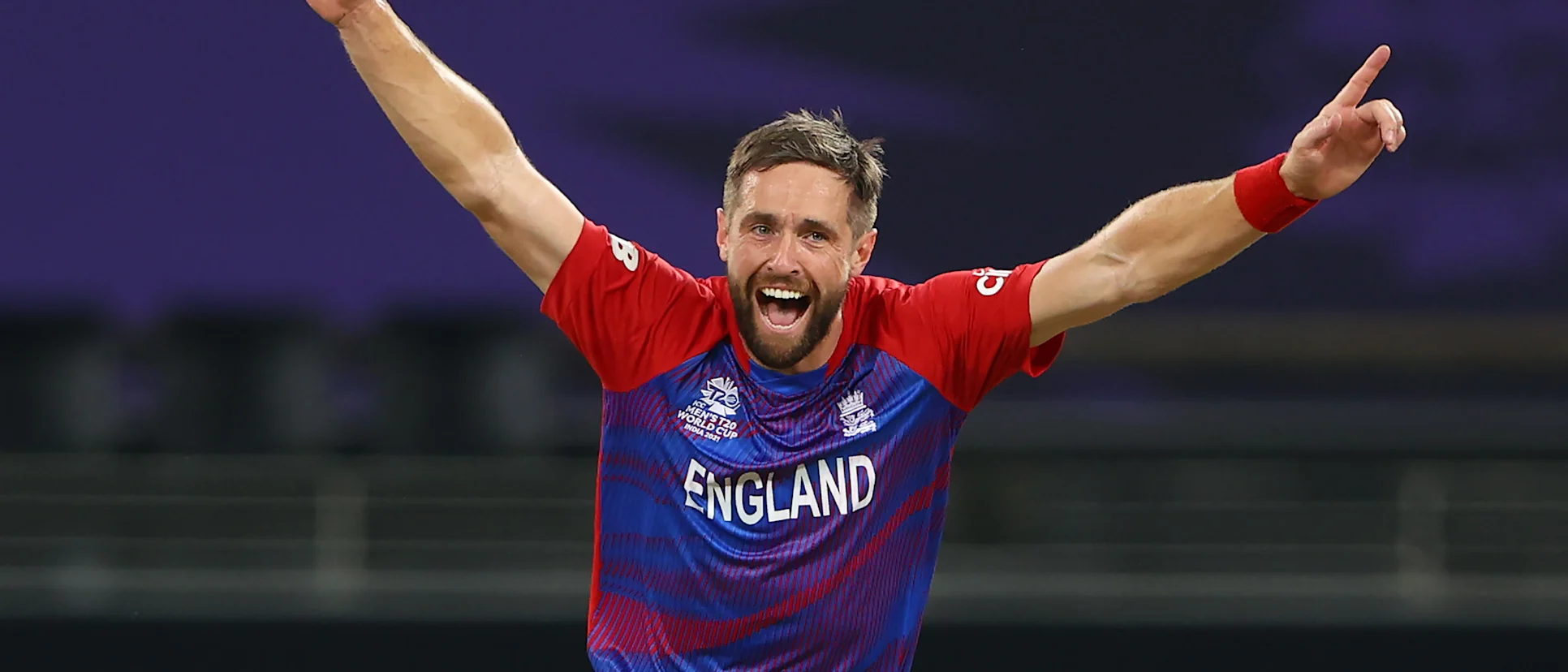 Chris Woakes of England celebrates the wicket of Glenn Maxwell of Australia during the ICC Men's T20 World Cup match between Australia and England at Dubai International Stadium on October 30, 2021 in Dubai, United Arab Emirates.