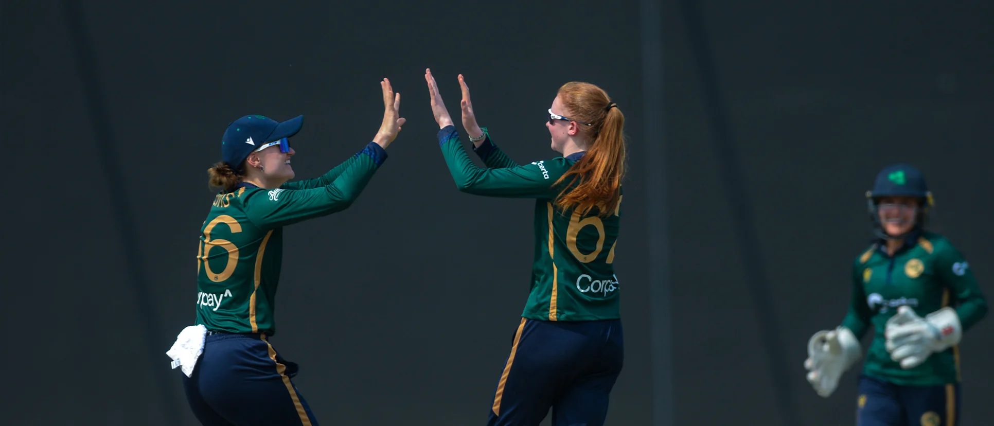 Logo of Kia McCartney (right) takes her first international wicket