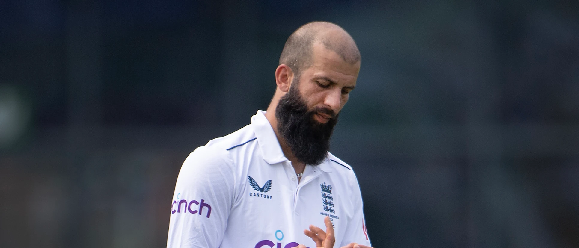 Logo of Moeen Ali of England examines his blistered finger during Day Three of the LV= Insurance Ashes 1st Test match between England and Australia
