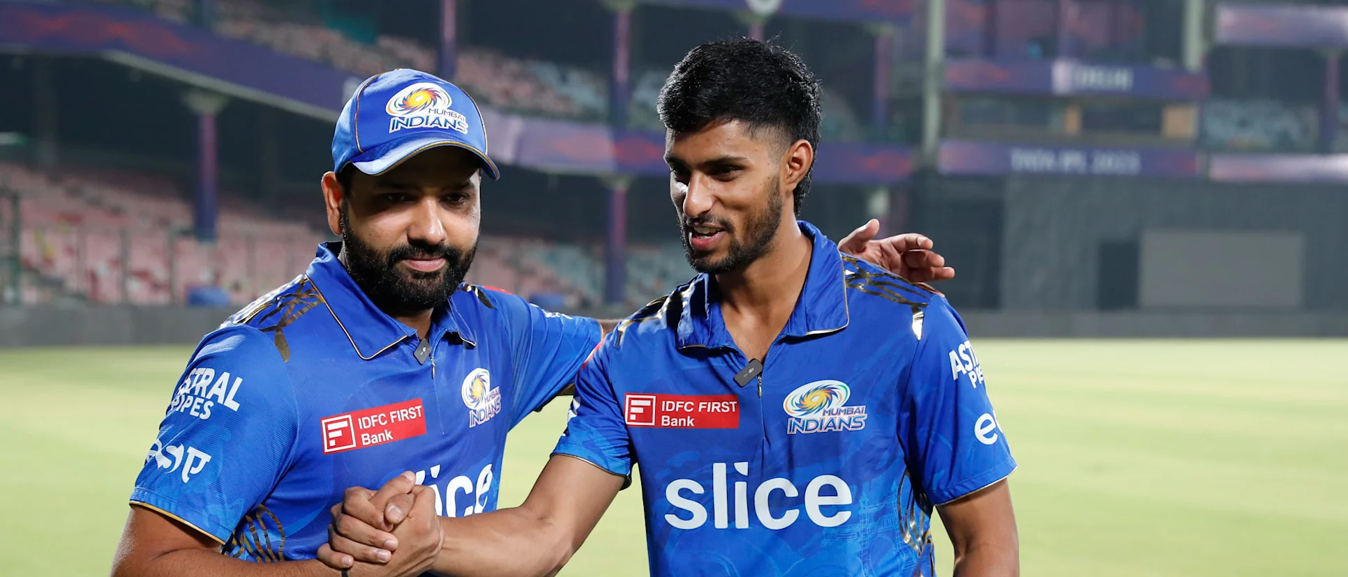 Logo of Tilak Varma alongside India captain Rohit Sharma at Mumbai