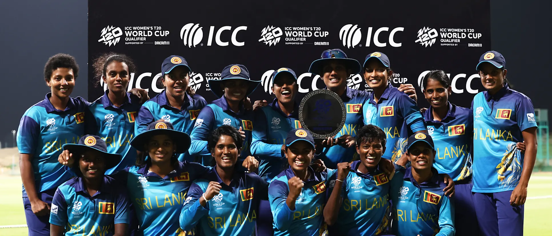 Logo of Players of Sri Lanka pose with the ICC Women's T20 World Cup Qualifier 2024 Trophy following the ICC Women's T20 World Cup Qualifier 2024 Final match between Scotland and Sri Lanka at Zayed Cricket Stadium on May 07, 2024 in Abu Dhabi, United Arab Emirates.