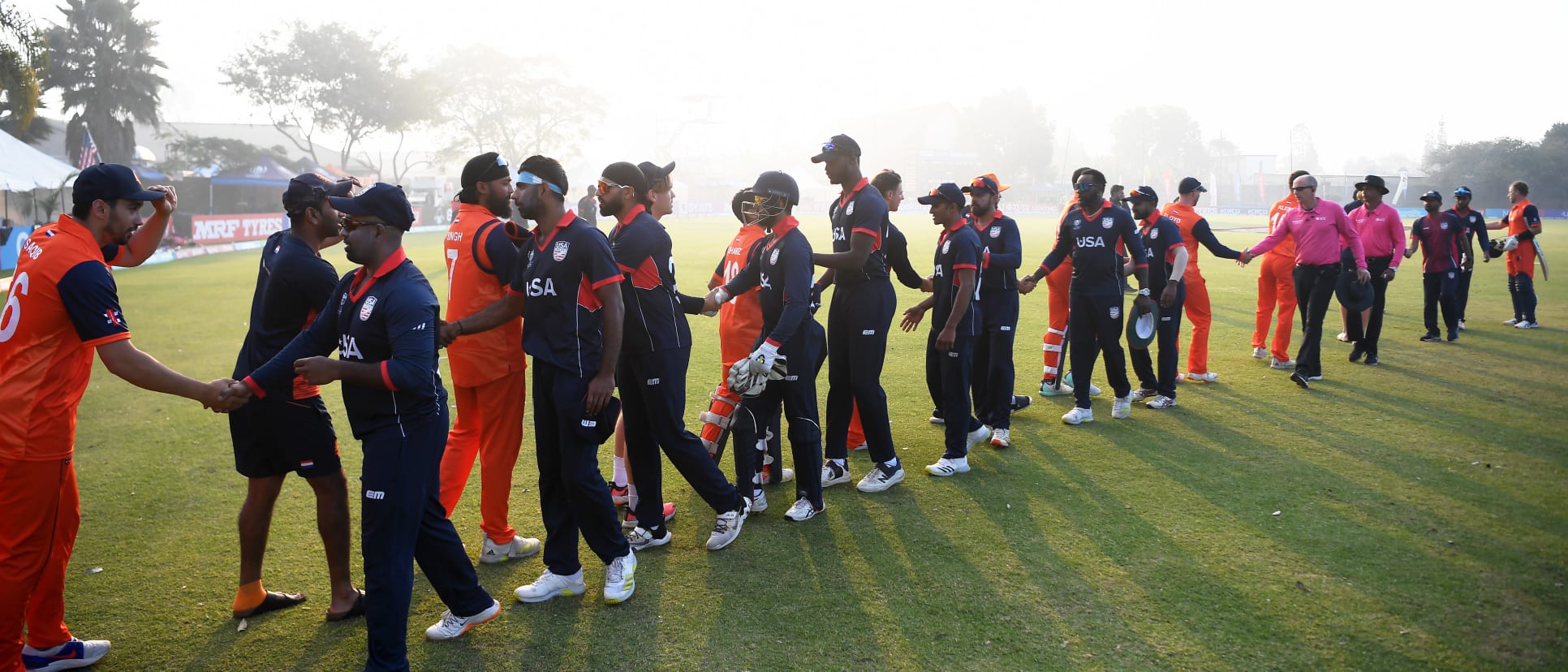 Players of USA and the Netherlands shake hands following the ICC Men's Cricket World Cup Qualifier Zimbabwe 2023 match between the Netherlands and USA at Takashinga Cricket Club on June 22, 2023 in Harare, Zimbabwe.
