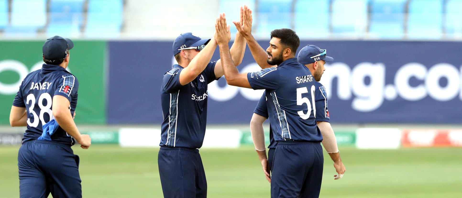 Scotland celebrate wicket of Chirag Suri