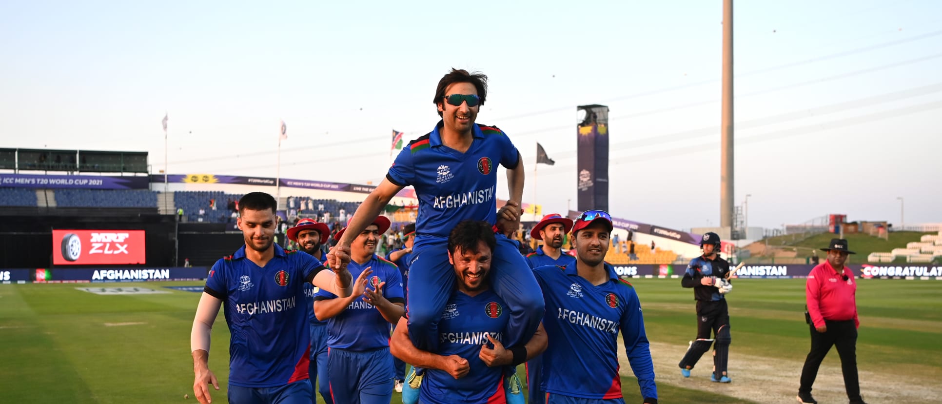 Asghar Afghan of Afghanistan is carried off by team mates after his final game during the ICC Men's T20 World Cup match between Afghanistan and Namibia at Sheikh Zayed stadium on October 31, 2021 in Abu Dhabi, United Arab Emirates.