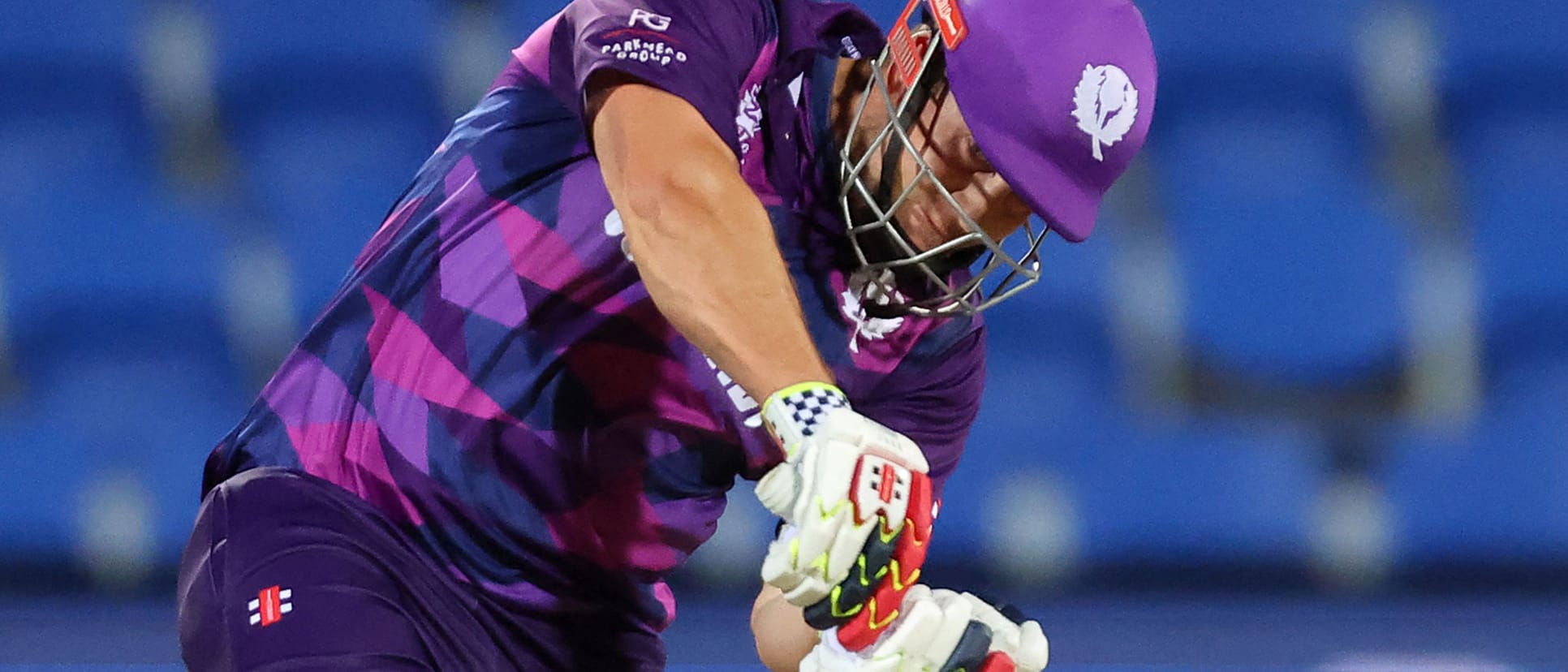 Scotland's George Munsey (L) plays a shot watched by Zimbabwe's wicketkeeper Regis Chakabva during the ICC mens Twenty20 World Cup 2022