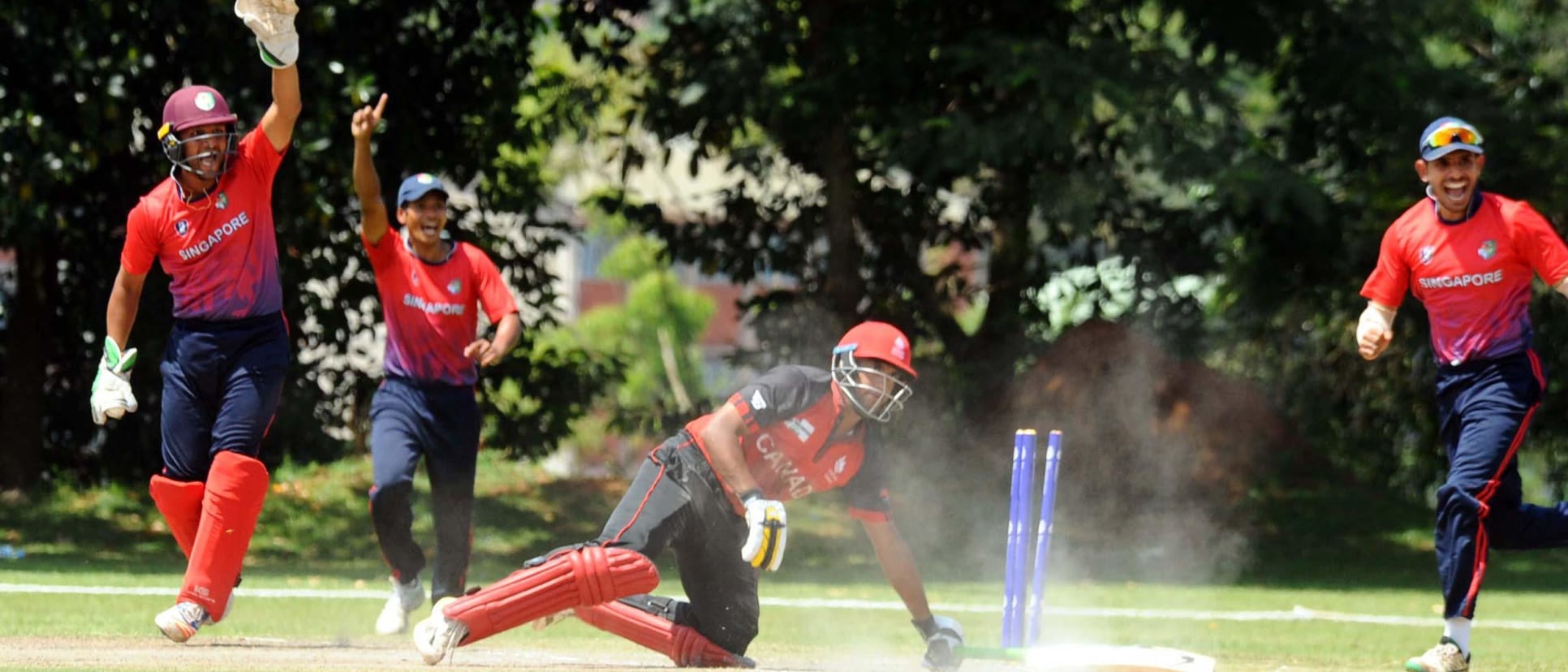 Singapore fielders appeal in their World Cricket League match against Singapore.