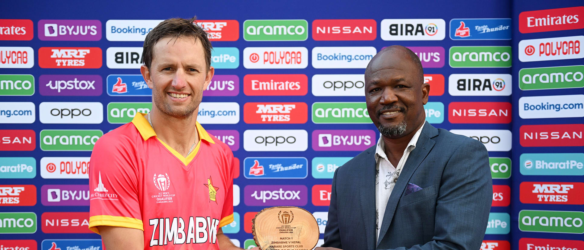 Craig Ervine of Zimbabwe poses for a photograph with the Harare Sports Club Player of the Match award which is presented to them by Givemore Makoni, Manager Director of Zimbabwe Cricket.