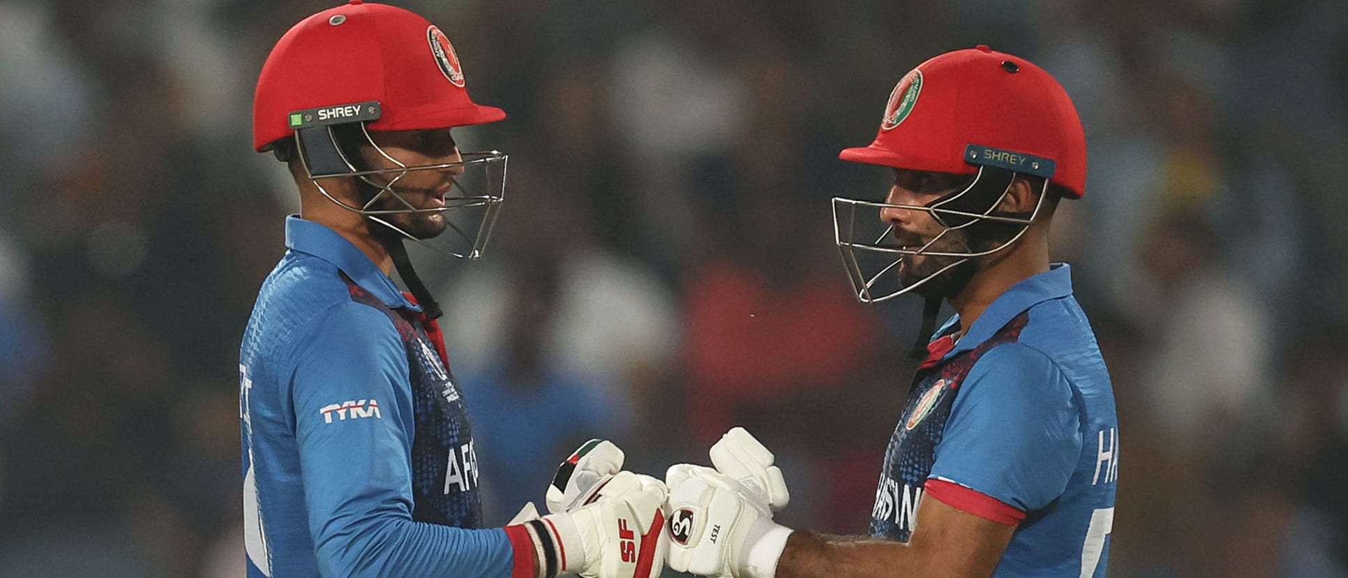 Azmatullah Omarzai and Hashmatullah Shahidi of Afghanistan interact during the ICC Men's Cricket World Cup India 2023 between Afghanistan and Sri Lanka