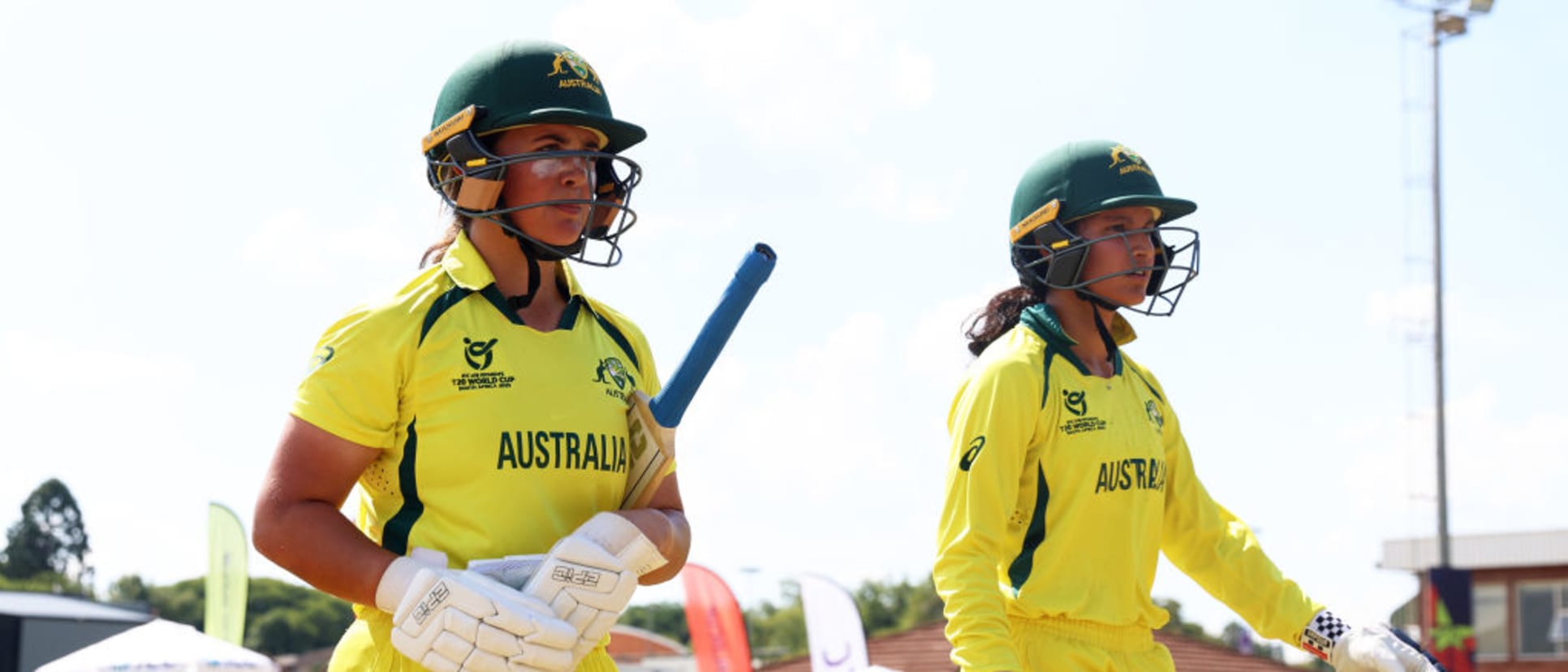 Kate Pelle and Sianna Ginger of Australia make their way out to bat during the ICC Women's U19 T20 World Cup 2023 Super 6 match between India and Australia at North-West University Oval on January 21, 2023 in Potchefstroom, South Africa.