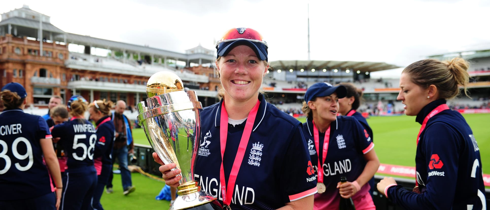 Anya Shrubsole poses with the trophy.