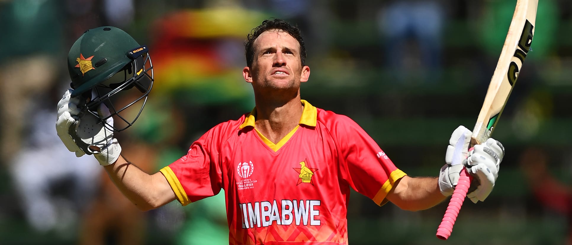 Sean Williams of Zimbabwe celebrates after scoring a century during the ICC Men's Cricket World Cup Qualifier Zimbabwe 2023 match between Zimbabwe and USA