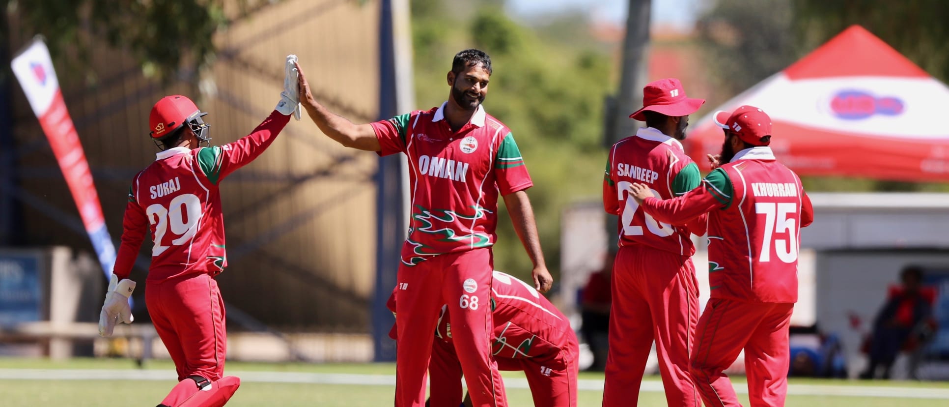 Oman Players celebrating a wicket 