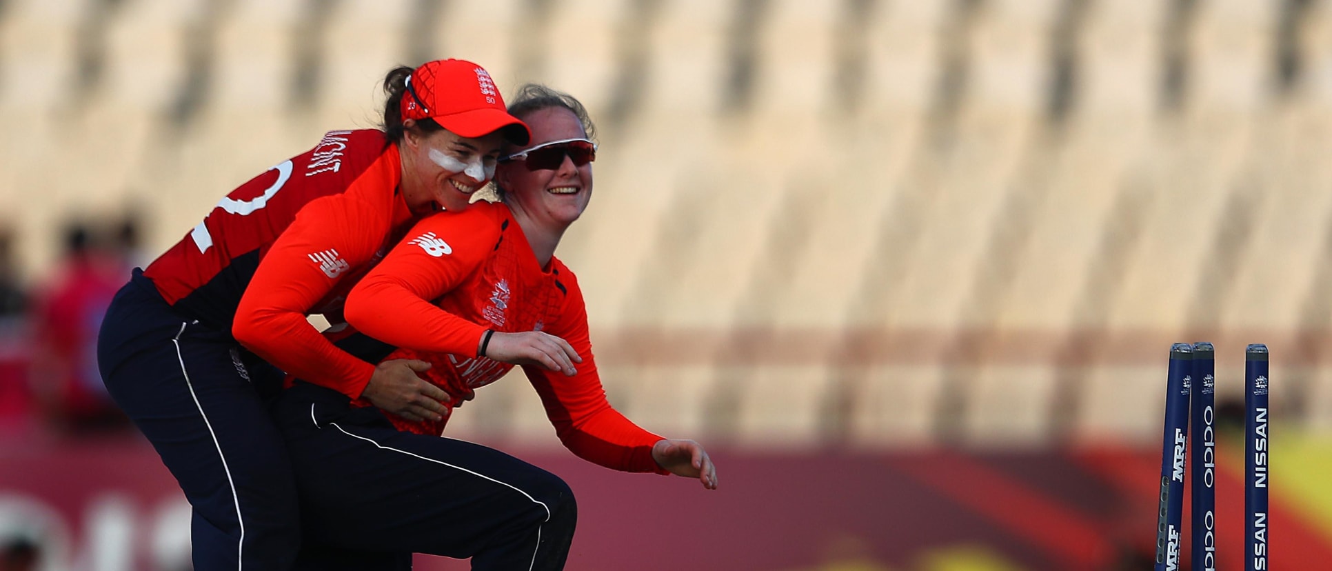 Tammy Beaumont of England congratulates Kirstie Gordon of England on running out Dane van Niekerk of South Africa during the ICC Women's World T20 2018 match between England and South Africa at Darren Sammy Cricket Ground on November 16, 2018.