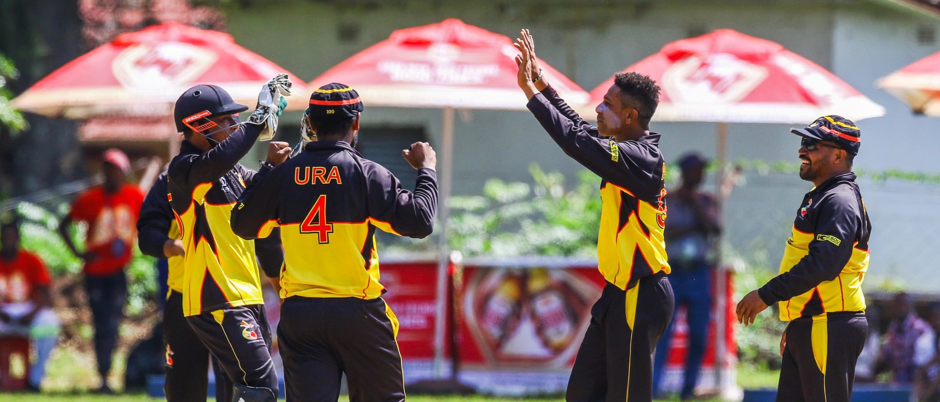 PNG bowler CJ Charles Amini celebratesa a wicket with his team mates during a play off match between Hong Kong and Papua New Guinea in the World Cup Quailfiers played at Old Hararians, March 17 2017 (©ICC).