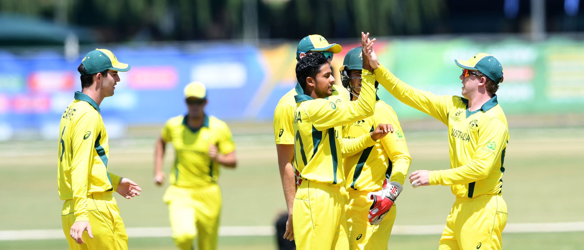 Tanveer Sangha of Australia celebrates the wicket of Sediqullah Atal of Afghanistan with his team mates during the ICC U19 Cricket World Cup Super League Play-Off Semi-Final match between Australia and Afghanistan at Absa Puk Oval on February 2, 2020.