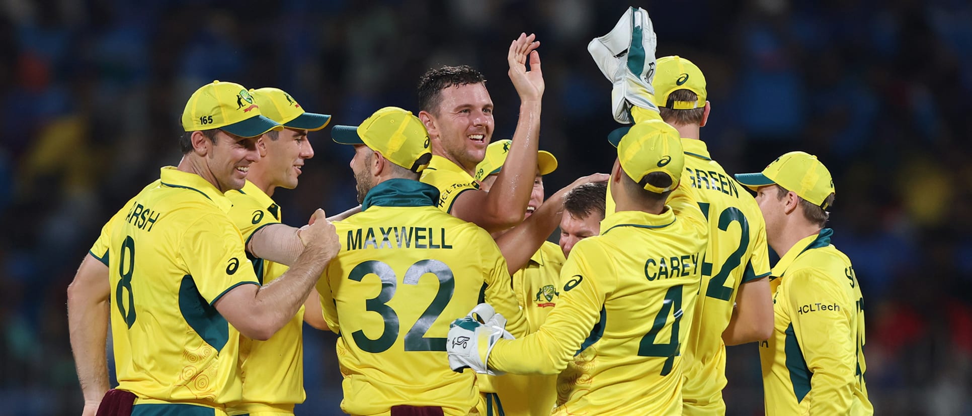 Josh Hazlewood of Australia celebrates with teammates after taking the wicket of Shreyas iyer of India during the ICC Men's Cricket World Cup India 2023 between India and Australia 