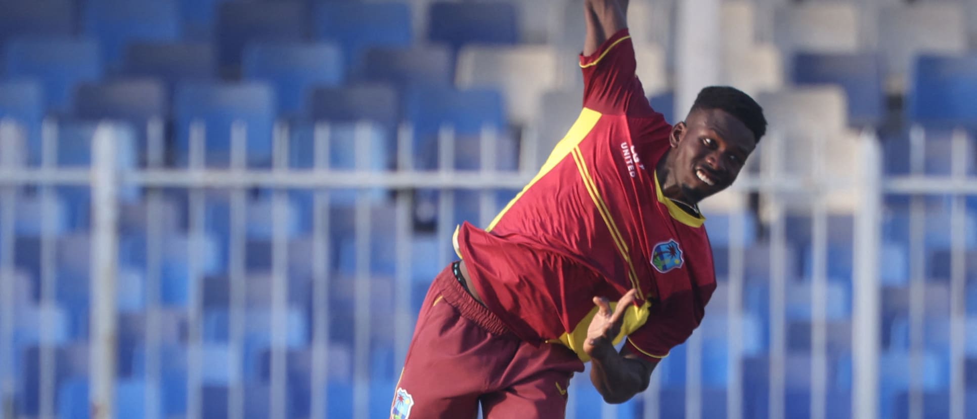 West Indies' Kevin Sinclair delivers a ball during the third one-day international (ODI) cricket match between the United Arab Emirates and West Indies at the Sharjah Cricket Stadium in Sharjah on June 9, 2023.