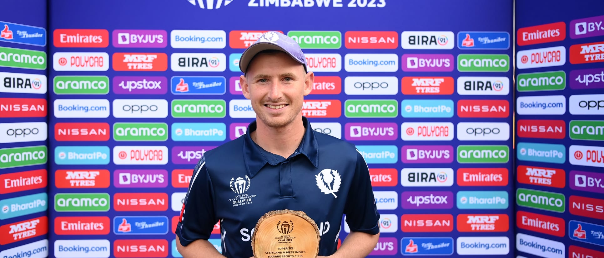 Brandon McMullen of Scotland poses after being named Player of the Match following the ICC Men's Cricket World Cup Qualifier Zimbabwe 2023 Super 6 match between Scotland and West Indies at Harare Sports Club on July 01, 2023 in Harare, Zimbabwe.