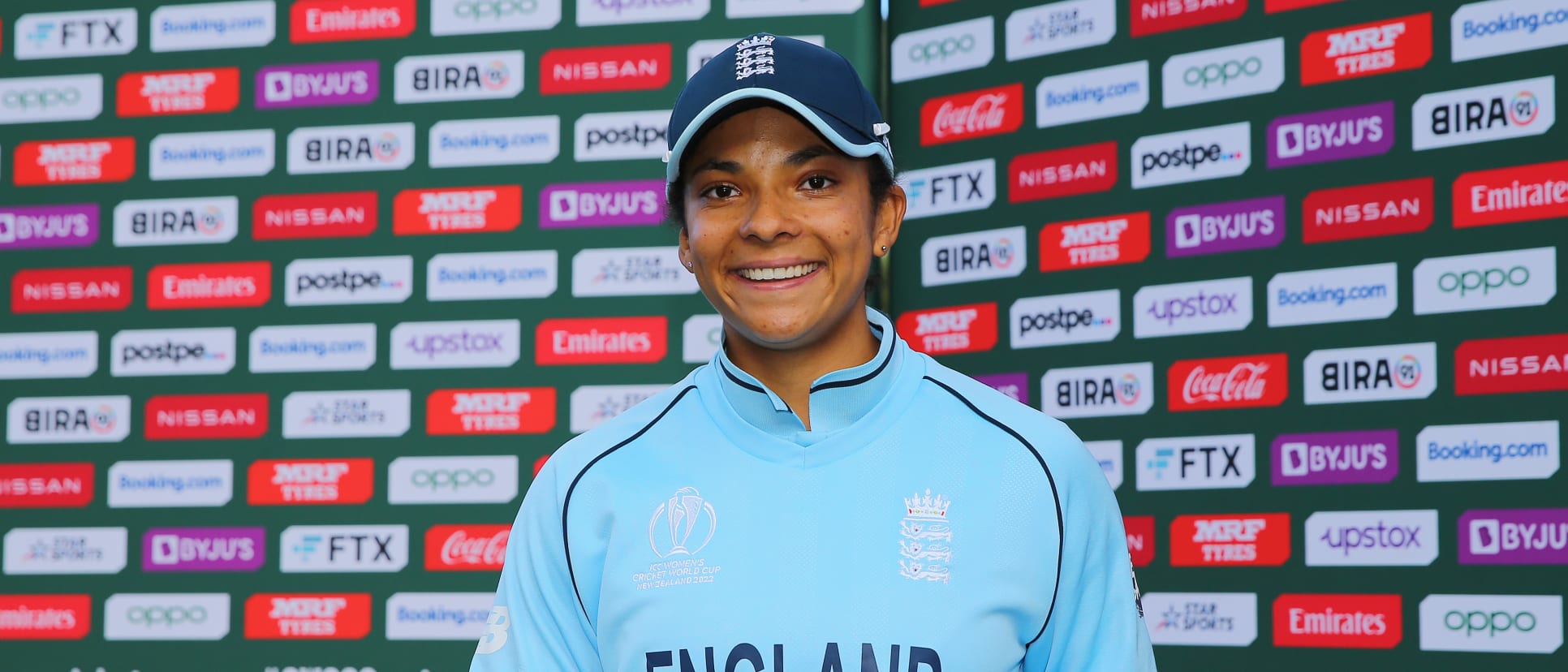 Sophia Dunkley of England poses with the Player of the Match award after the 2022 ICC Women's Cricket World Cup match between England and Bangladesh at Basin Reserve on March 27, 2022 in Wellington, New Zealand.