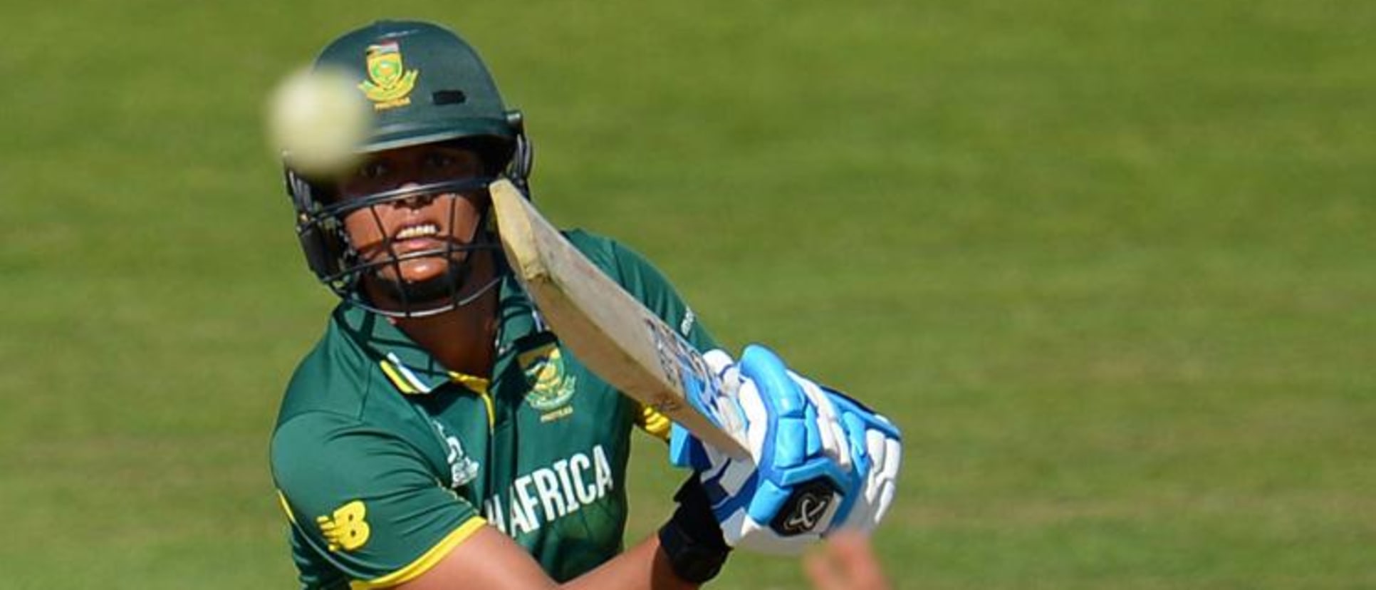 Chloe Tryon of South Africa bats as Danielle Hazell of England attempts to stop the ball during the ICC Women's World Cup 2017 match.