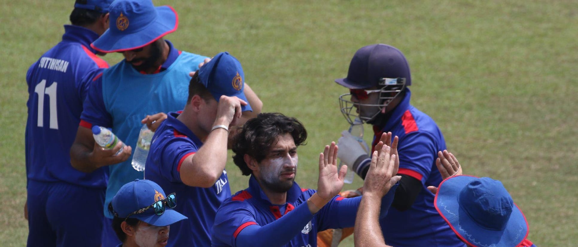 Mahsid Faheem celebrates with his teammates