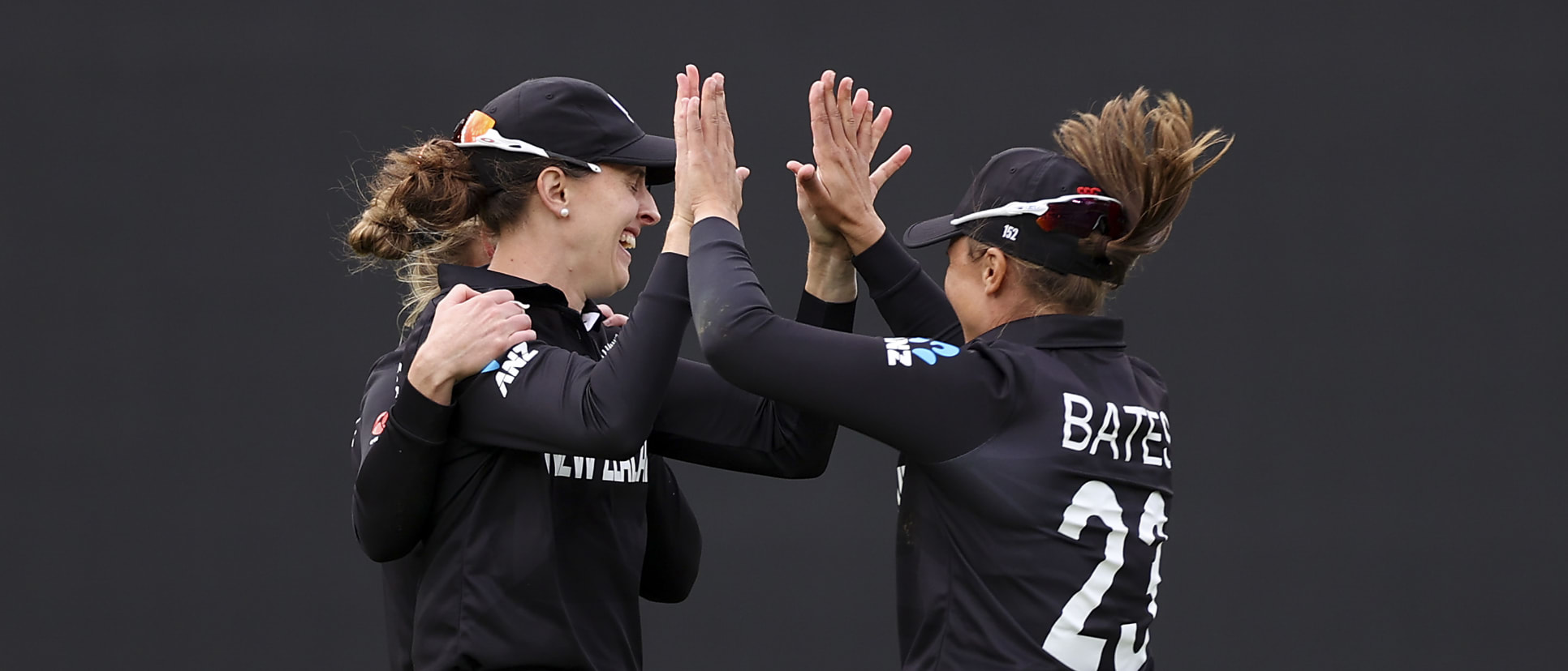 Amy Satterthwaite (L) of New Zealand celebrates with Suzie Bates after taking the wicket of Amy Jones of England during the 2022 ICC Women's Cricket World Cup match between New Zealand and England at Eden Park on March 20, 2022 in Auckland, New Zealand.