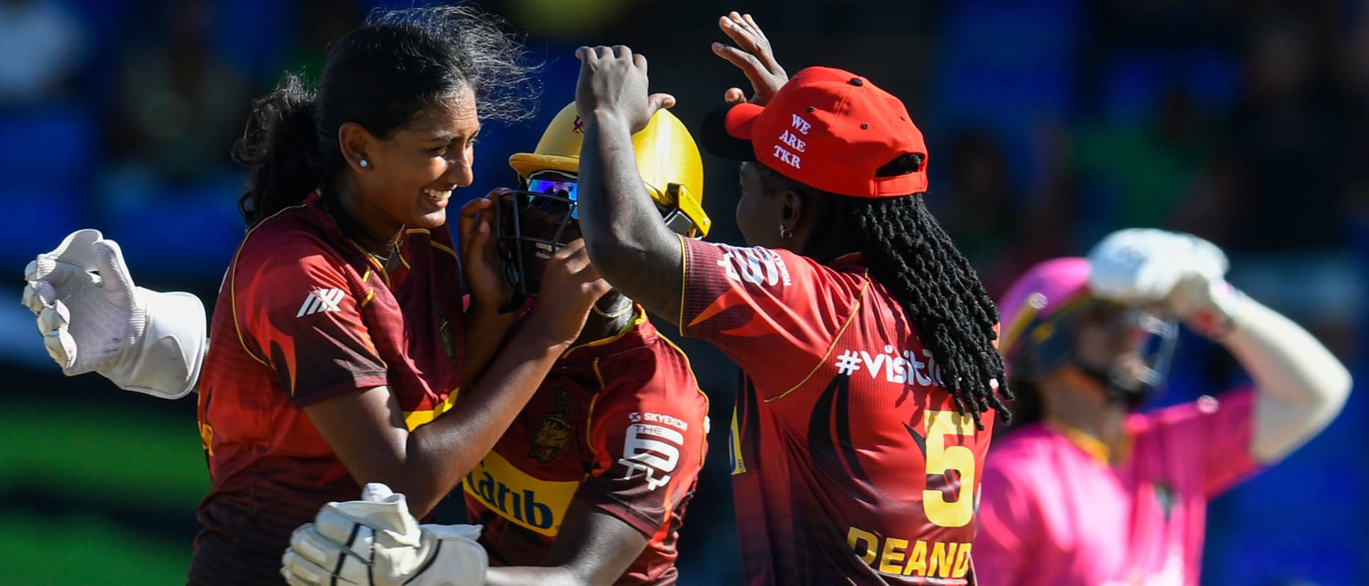 Kodali (left) celebrates a wicket in the Caribbean Premier League