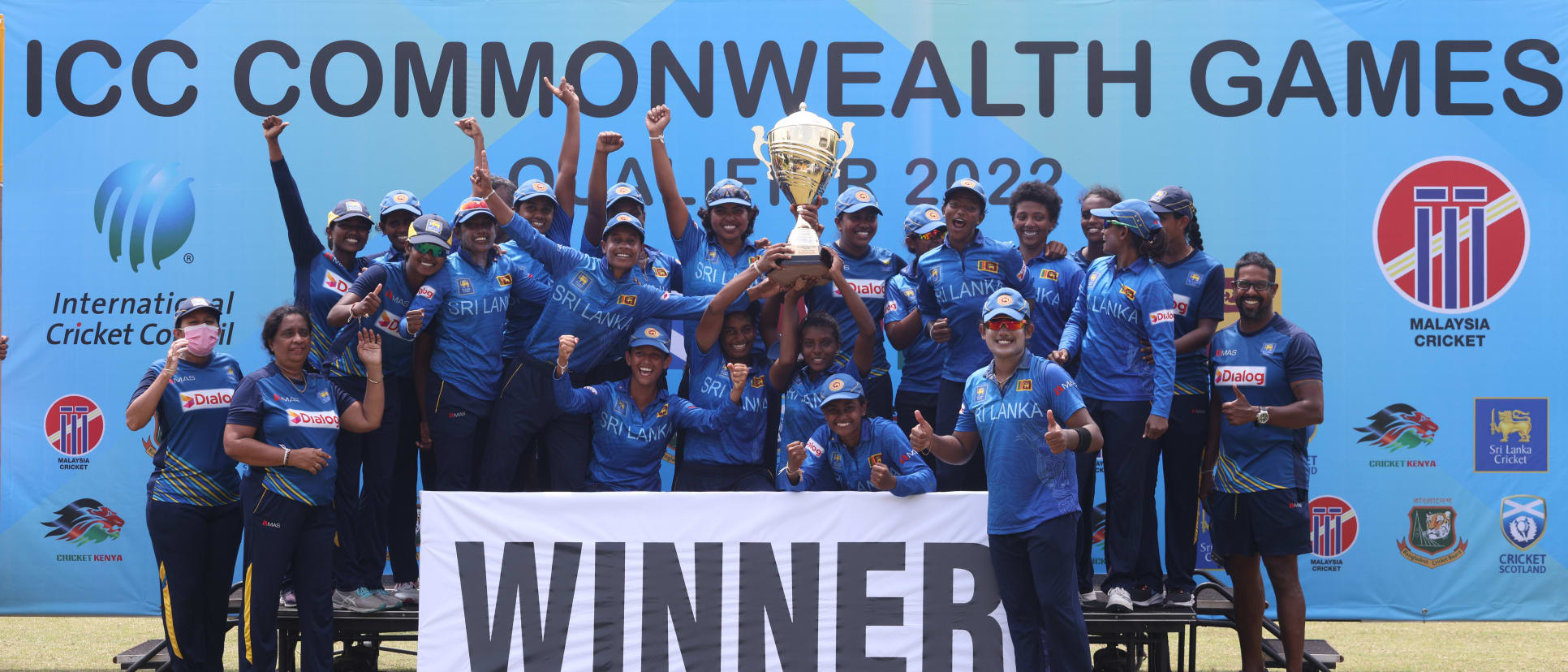 The victorious Sri Lankan team poses with the trophy after winning all four games in the CWG22 Qualifier.