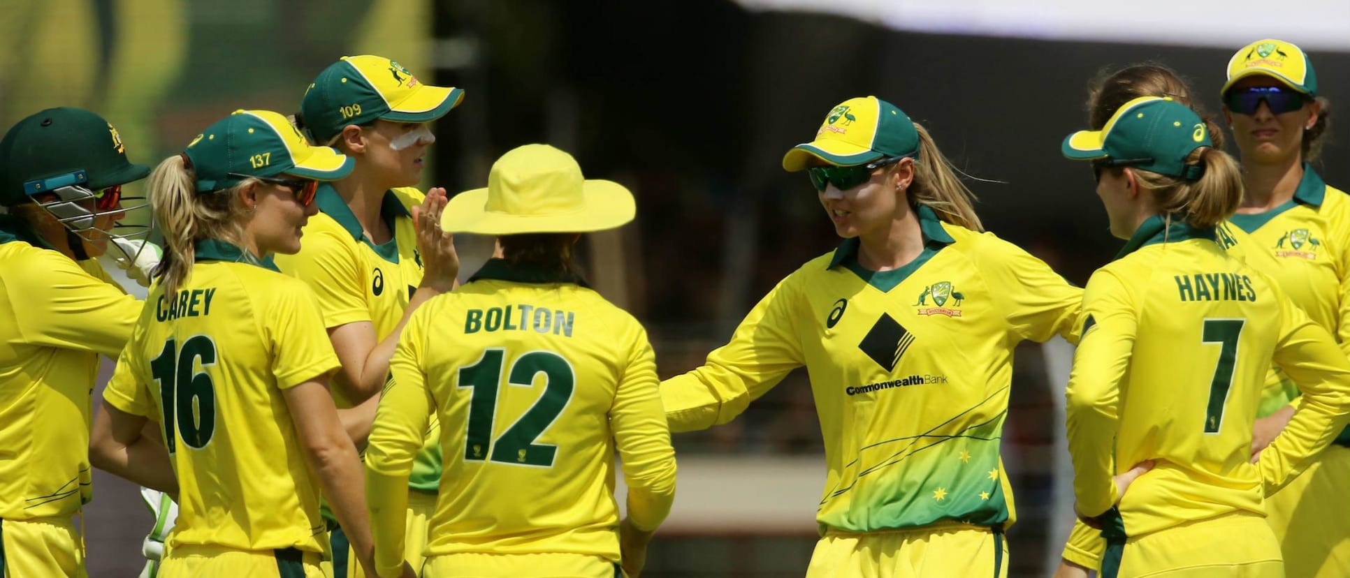 The Australians celebrate the fall of Smriti Mandhana's wicket