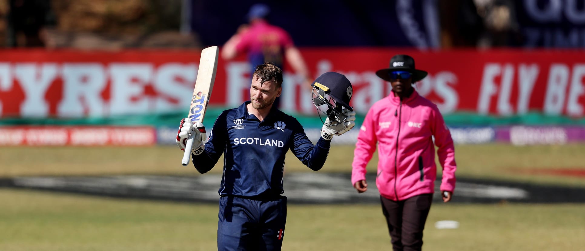 Richard Berrington of Scotland celebrates after reaching his century during the ICC Men´s Cricket World Cup Qualifier Zimbabwe 2023 match between Scotland and UAE at Bulawayo Athletic Club on June 23, 2023 in Bulawayo, Zimbabwe.