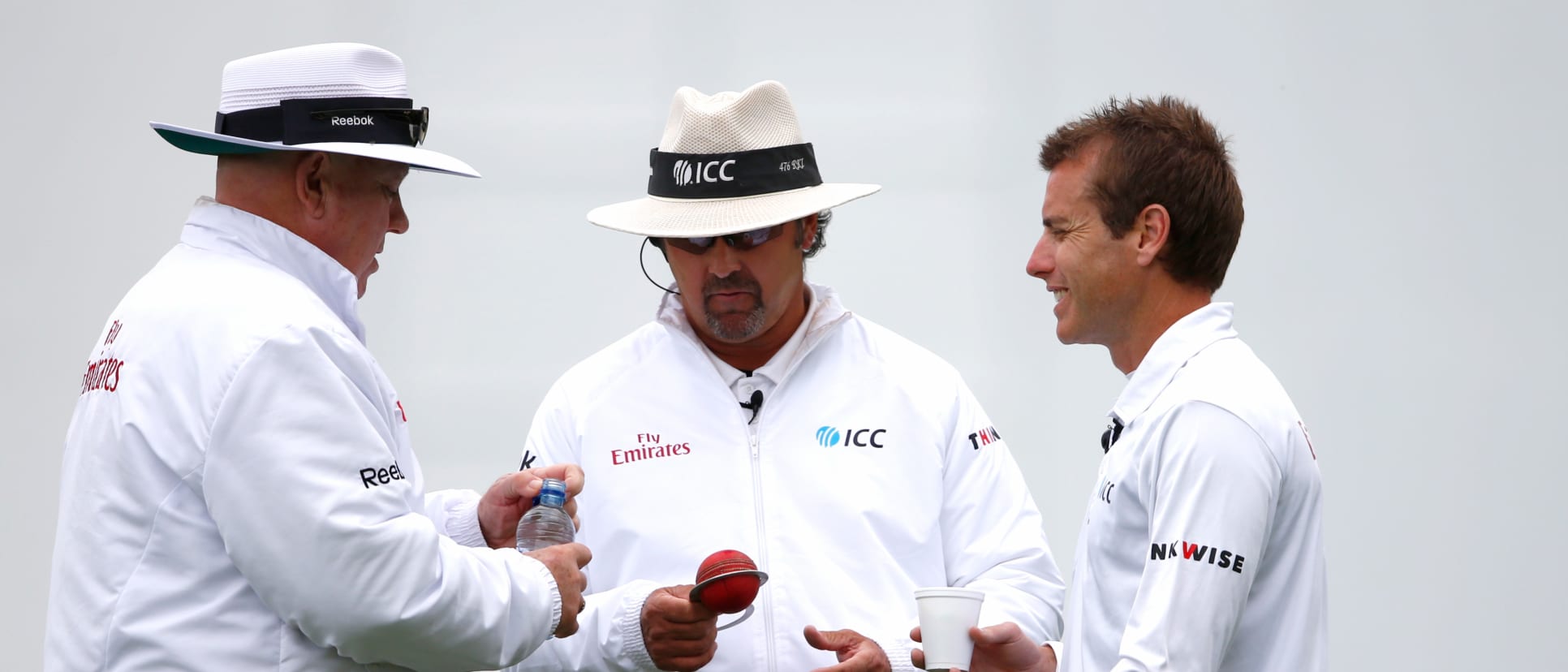 Umpire Richard Illingworth (C) tests the ball with Steve Davis (L) and Chris Gaffaney (R) during day four of the Second Test match between New Zealand and Sri Lanka at the Basin Reserve on January 6, 2015 in Wellington, New Zealand