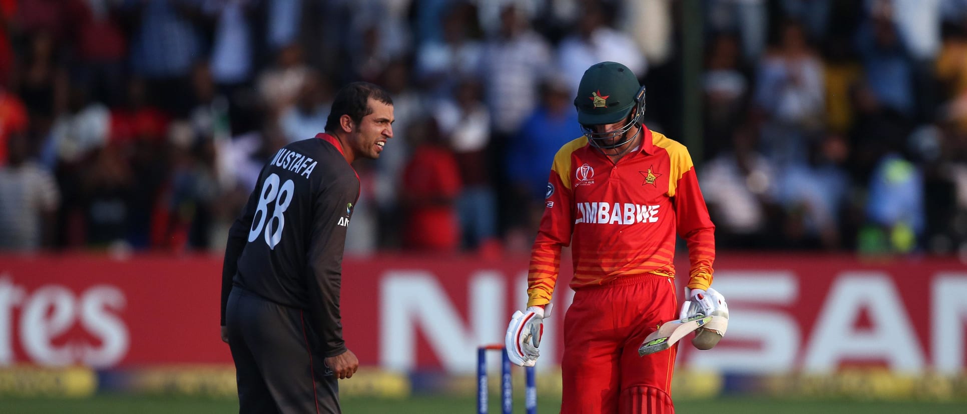 Rohan Mustafa of the UAE gives Sean Williams of Zimbabwe a send off during The ICC Cricket World Cup Qualifier between the UAE and Zimbabwe at The Harare Sports Club on March 22, 2018 in Harare, Zimbabwe.