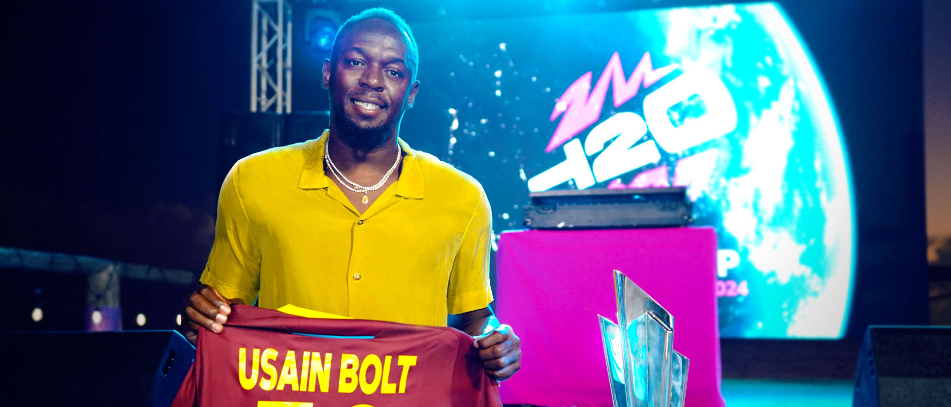 Usain Bolt with the ICC Men's T20 World Cup trophy