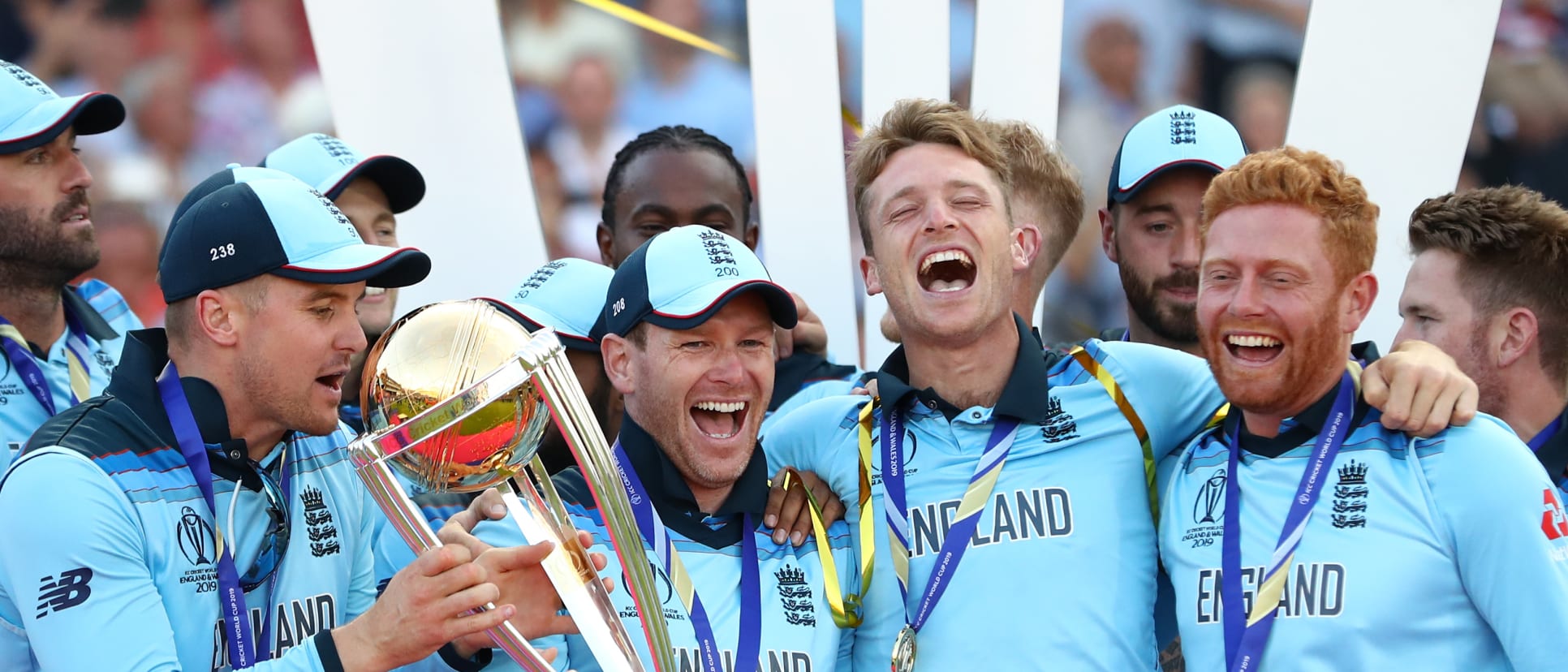 England Captain Eoin Morgan lifts the World Cup with the England team after victory for England during the Final of the ICC Cricket World Cup 2019 between New Zealand and England at Lord's Cricket Ground on July 14, 2019 in London, England.