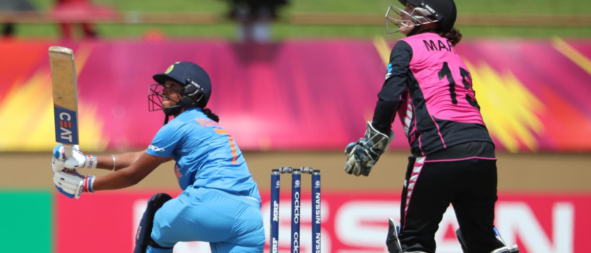 Harmanpreet Kaur of India sweeps as Katey Martin of New Zealand looks on during match 1 of the ICC Women's World T20 match between New Zealand v India on November 9, 2018 at the National Stadium in Providence, Guyana.