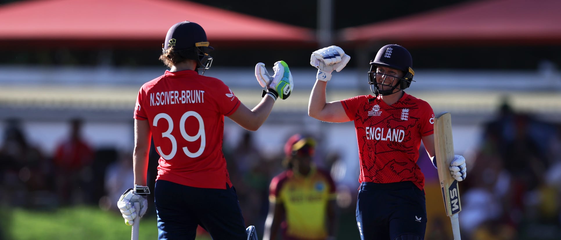 Heather Knight and Nat Sciver-Brunt of England celebrate following the ICC Women's T20 World Cup group B match between West Indies and England at Boland Park on February 11, 2023 in Paarl, South Africa.