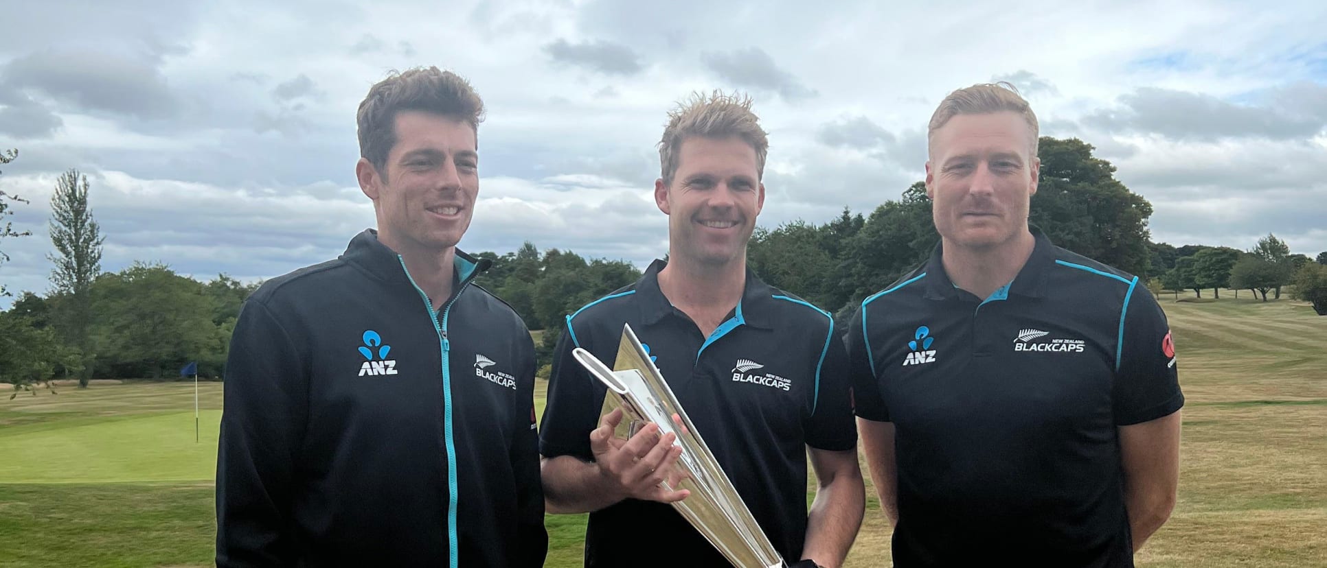 New Zealand's Mitchell Santner, Lockie Ferguson and Martin Guptill with the T20 World Cup trophy in Scotland