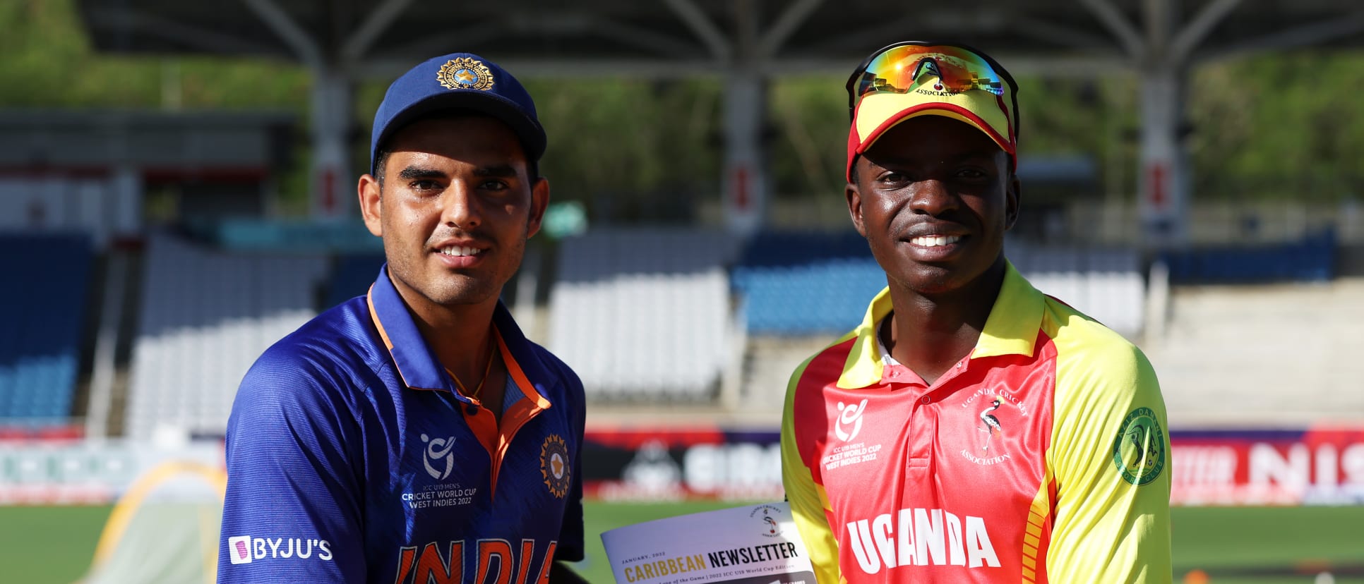 Nishant Sindhu of India is presented with a commemorative plaque by Pascal Murungi of Uganda ahead of the ICC U19 Men's Cricket World Cup match between India and Uganda at Brian Lara Cricket Academy on January 22, 2022 in Tarouba, Trinidad And Tobago.